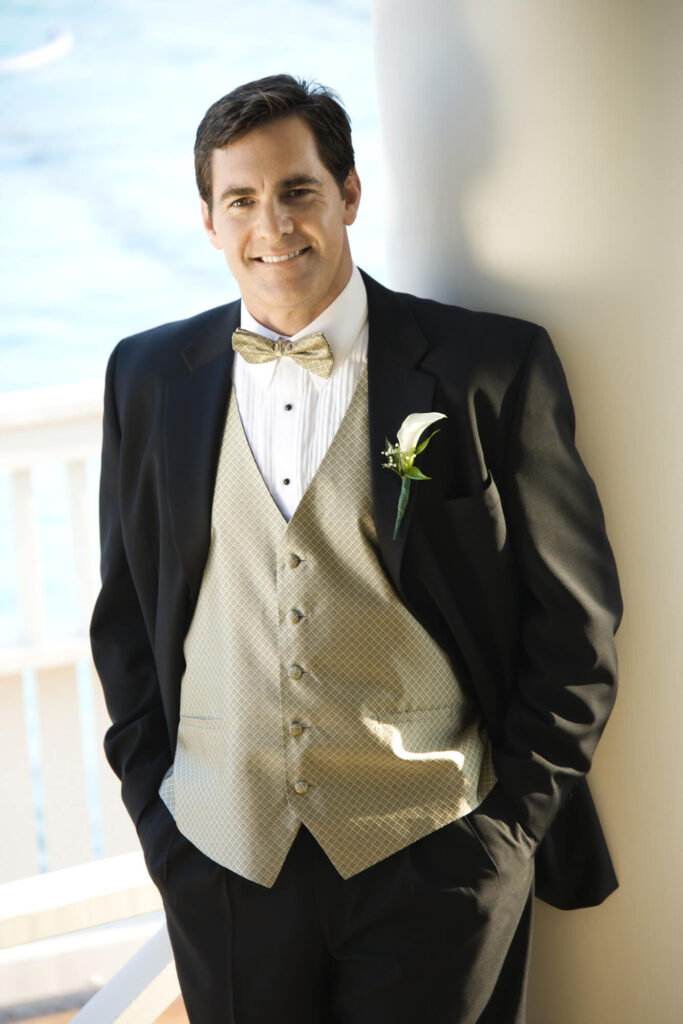 a man in a suit and bow tie